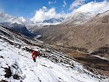 12 Gyan Tamang Descending Ridge From Taro Tso Towards Drakpochen After eating lunch next to Tara Tso (4363m), we ascend the ridge above the lake (4444m) and Gyan Tamang descends ahead of me towards the big rock at Drakpochen (4139m).